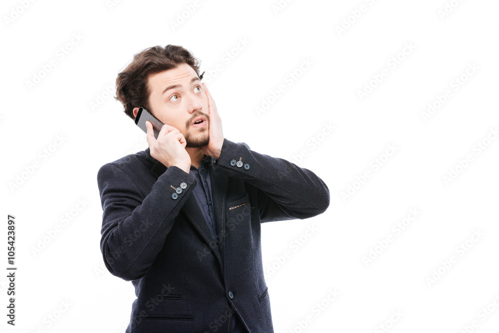 Thoughtful businessman talking on the phone Thoughtful businessman talking on the phone