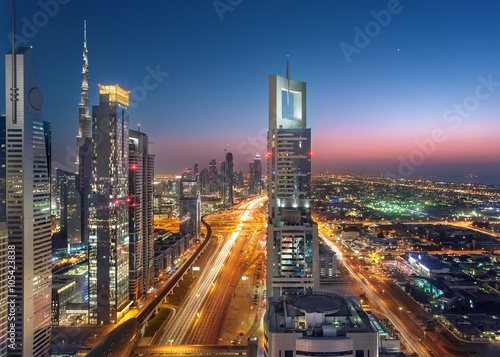 Dubai Sheikh Zayed Road by sunset with heavy traffic streets