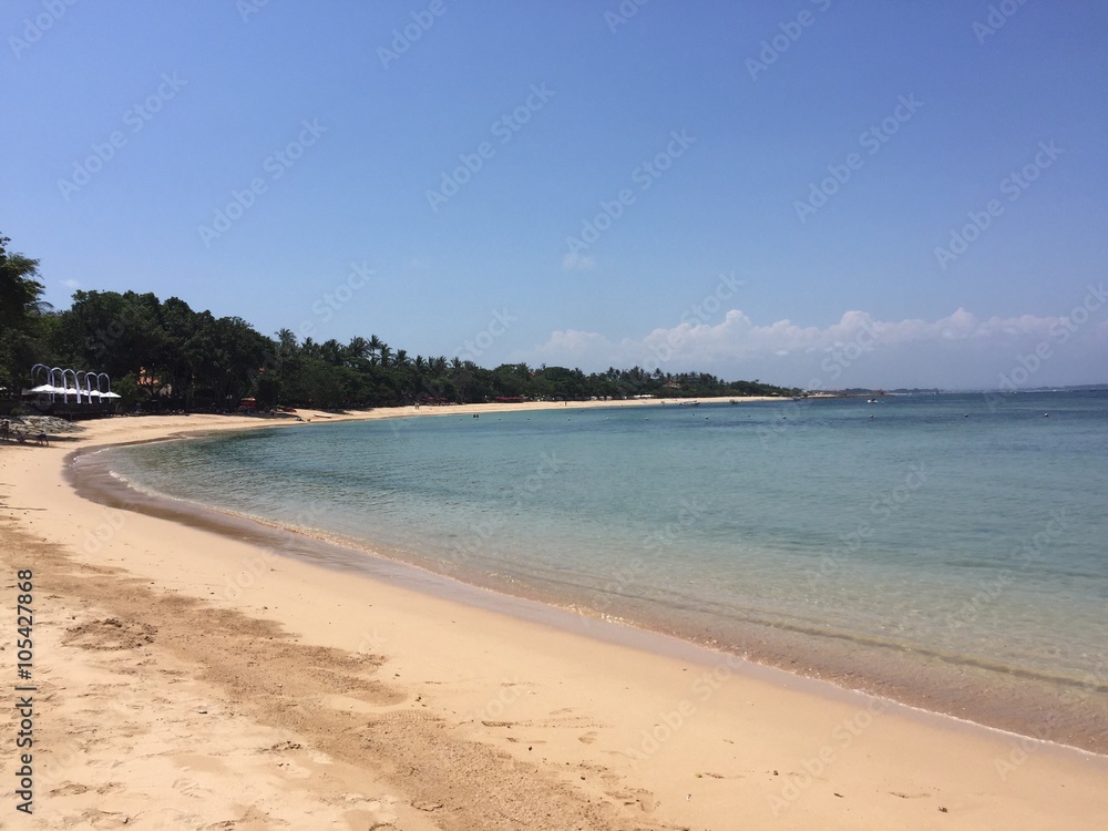 White beach and clean turquoise sea, Nusa Dua, Bali, Indonesia