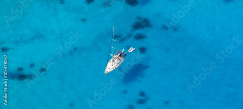 Aerial view of single yacht in azure sea © Jag_cz