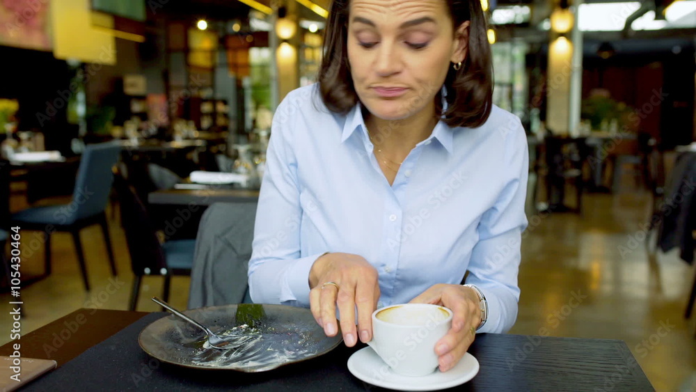 Businesswoman finish eating lunch and drinking coffee, steadycam shot
Businesswoman finish eating lunch and drinking coffee, steadycam shot