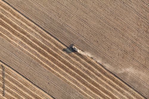 aerial view of the combine on harvest field