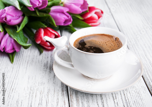 cup of coffee with tulips