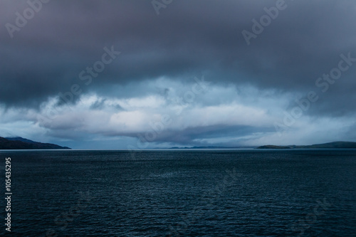 Eye shaped gathering storm at dusk near Mull, Scotland