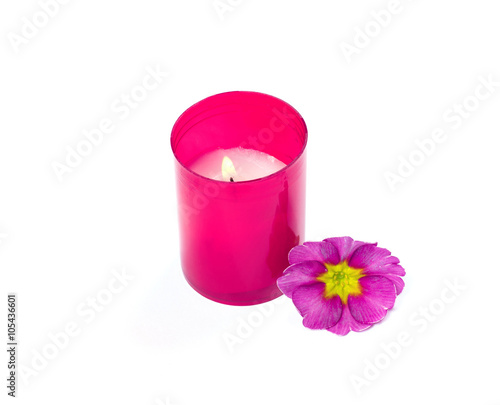 the burning pink candle and pink a flower