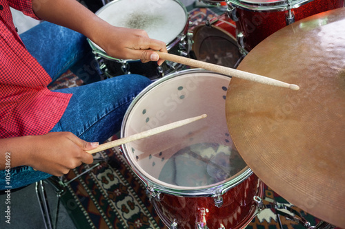 Midsection Of Female Drummer Performing