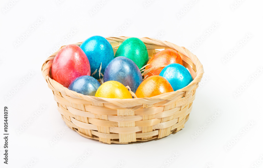 Easter eggs in a basket on a white background. Easter eggs in a basket on a white background.