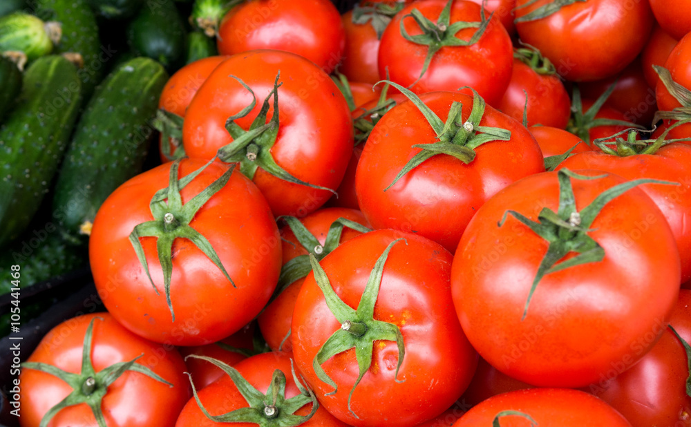 Healthy food, background. Red tomatoes with cucambers Healthy food, background. Red tomatoes with cucambers
