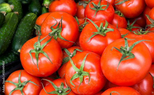 Healthy food  background. Red tomatoes with cucambers