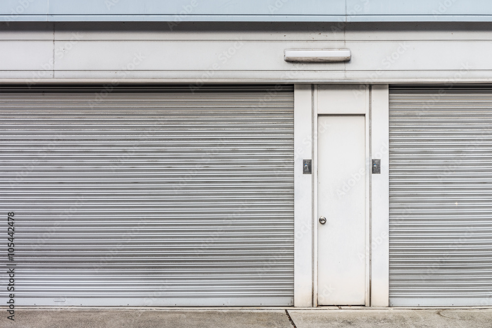 The steel doors of factory. There are panel and rolling doors. The steel doors of factory. There are panel and rolling doors.
