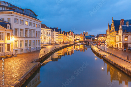 Picturesque medieval buildings on quay Korenlei and  quay Graslei   Leie river in the evening  blue hour  Ghent  Belgium