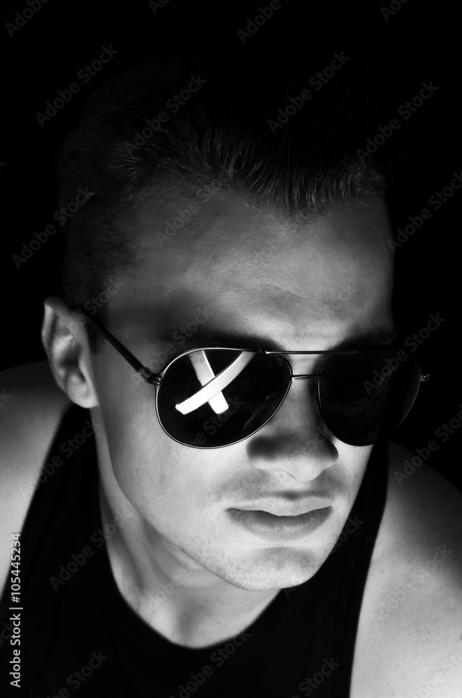 The guy in dark glasses with a cross The guy in dark glasses with a cross