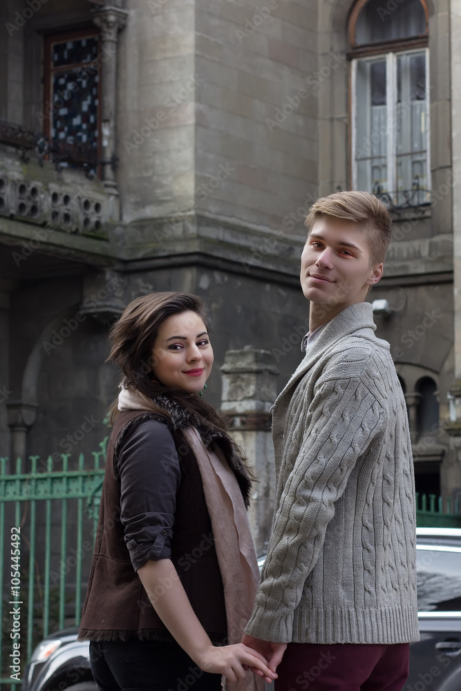 Young couple take each other by the hands on the street Young couple take each other by the hands on the street