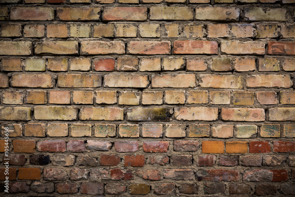 Naklejka premium Old weathered brick wall, texture, background