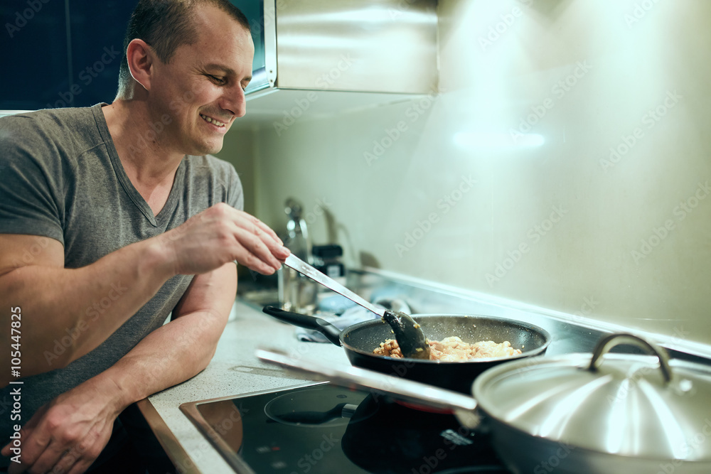 Man cooking at home alone Man cooking at home alone