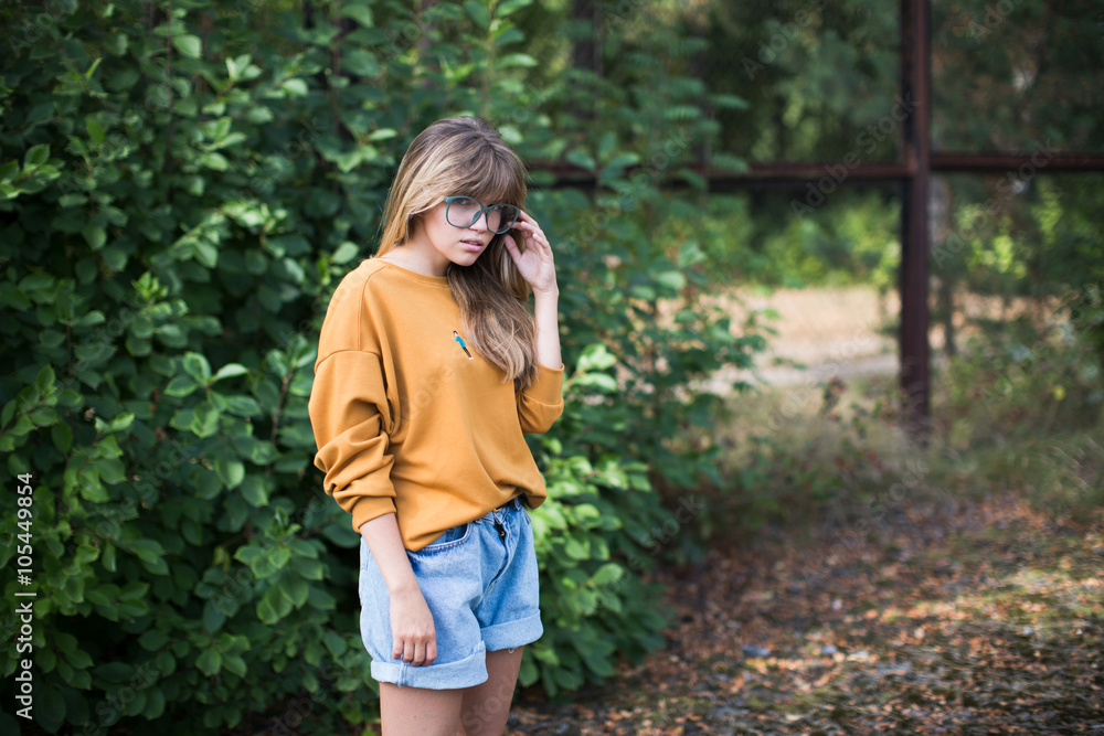 Beautiful hipster girl posing in the park Beautiful hipster girl posing in the park