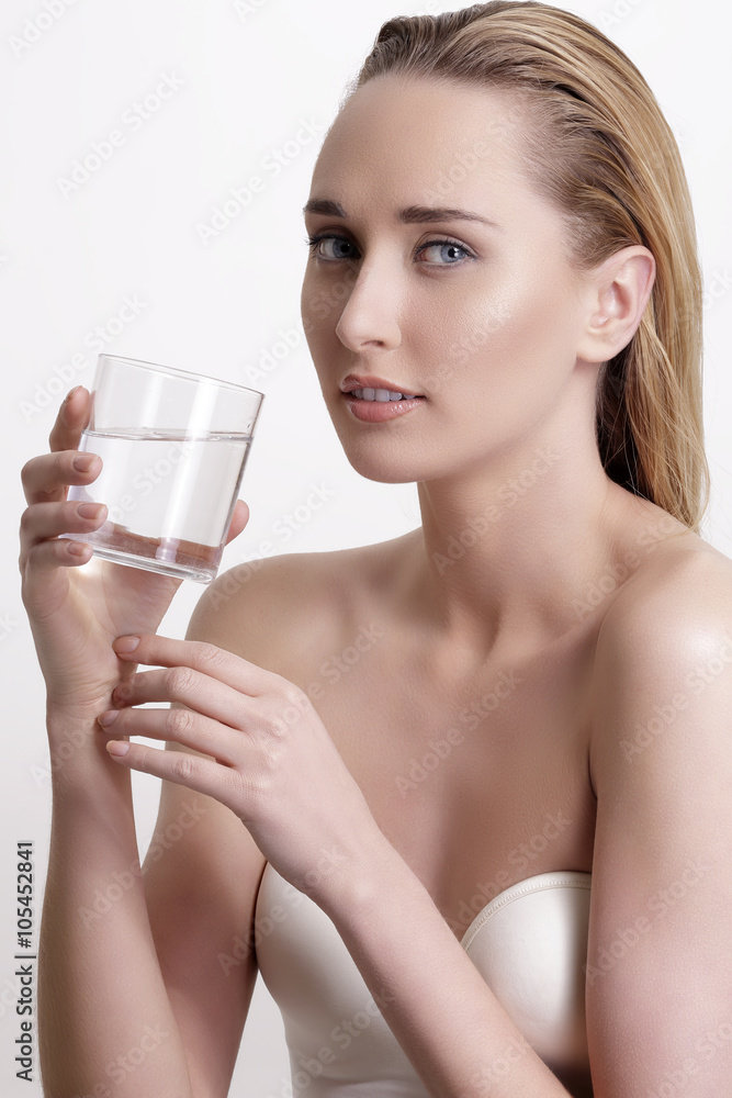 young beautiful woman drinking fresh water on white young beautiful woman drinking fresh water on white
