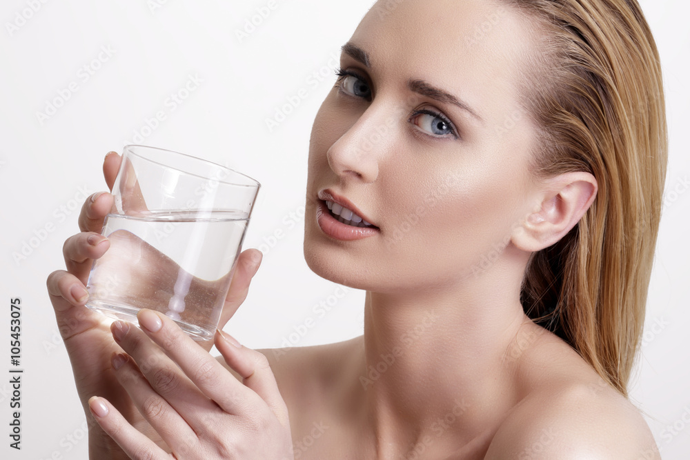 young beautiful woman drinking fresh water on white young beautiful woman drinking fresh water on white