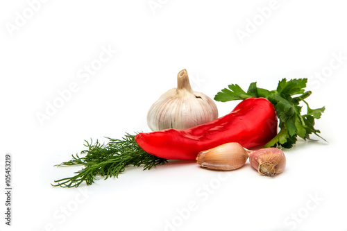 pepper, garlic and parsley on a white background