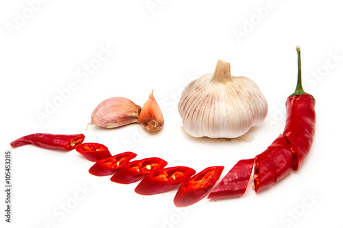 Garlic and chili pepper on a white background