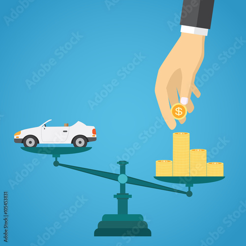 Scales with car and gold coins.