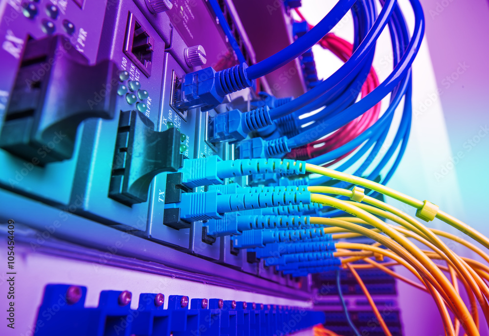 Fiber Optic cables connected to an optic ports and Network cable Fiber Optic cables connected to an optic ports and Network cable