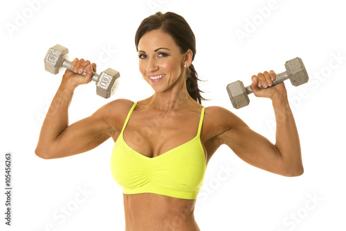 woman in green sports bra flex weights