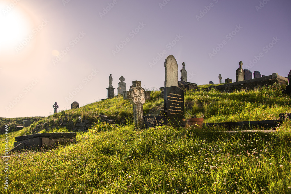 Old graveyard with tombstones on Malin Head, Ireland