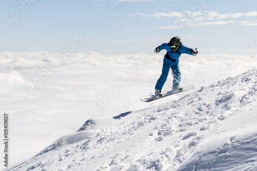 Freestyle snowboarder in the mountain