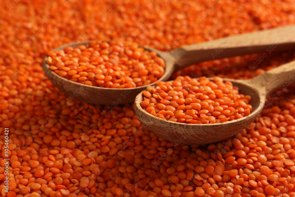 Red lentils in the wooden spoons Red lentils in the wooden spoons