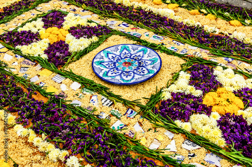 Vászonkép Handmade carpet of sawdust, flowers & ceramic in path of Lent procession in colonial town with most famous Holy Week celebrations in Latin America