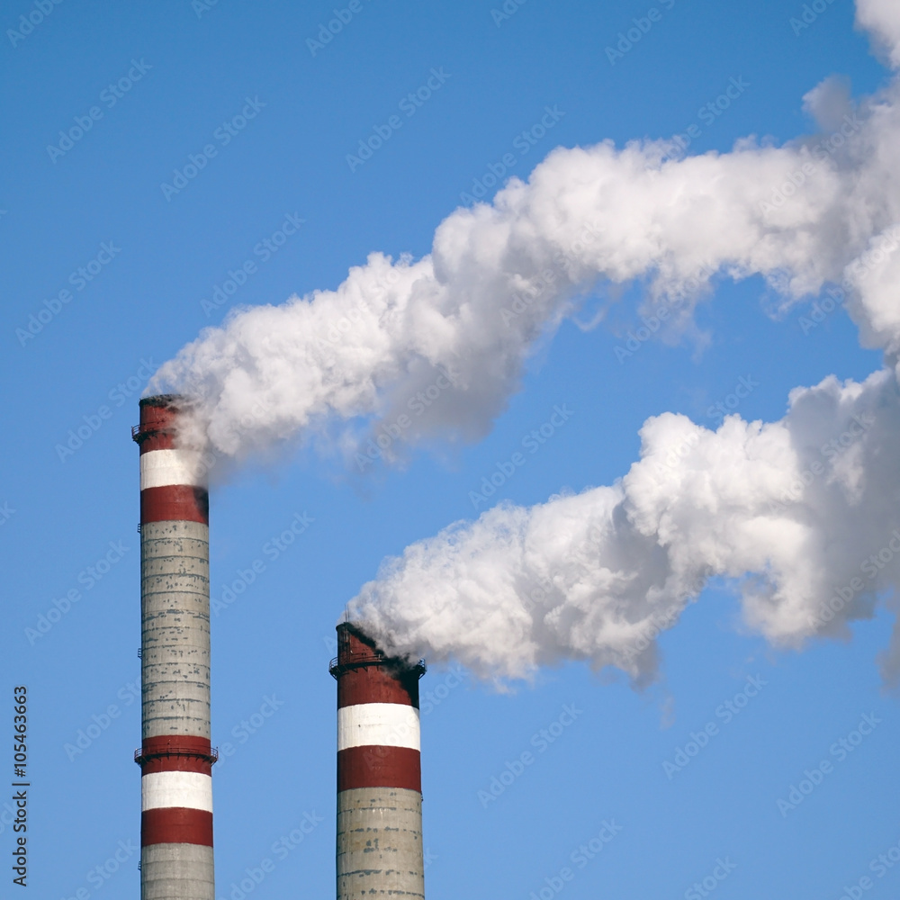 industrial chimneys emits toxic pollutants into the sky polluting environment industrial chimneys emits toxic pollutants into the sky polluting environment