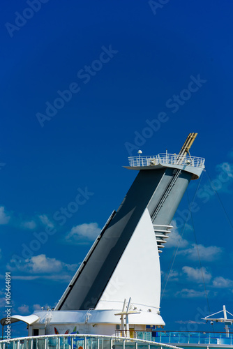 The chimney of a cruise ship with blue sky in the background