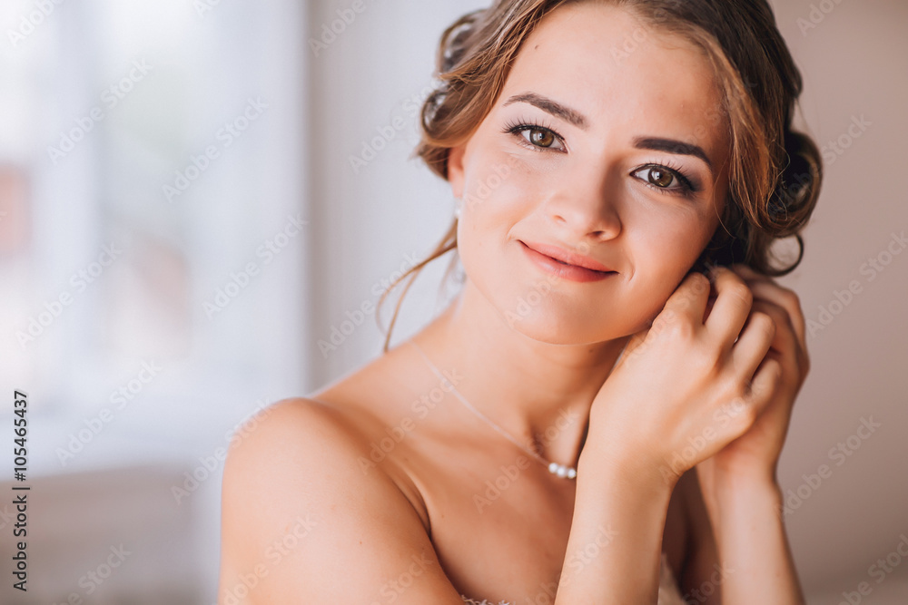 beautiful brunette stylish bride getting ready in the morning in the room