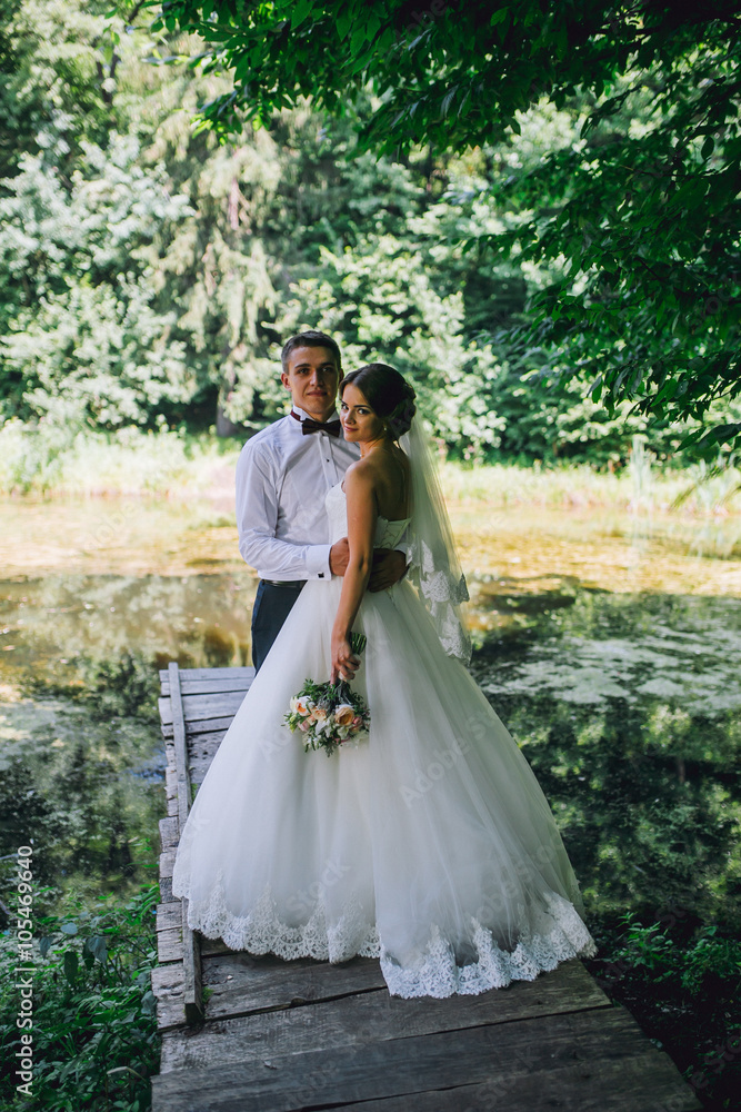 Married Couple in forest embracing Married Couple in forest embracing