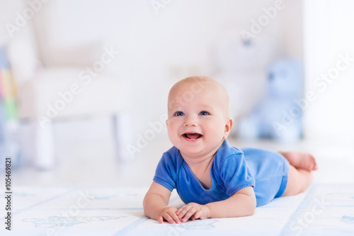 Baby boy in white nursery