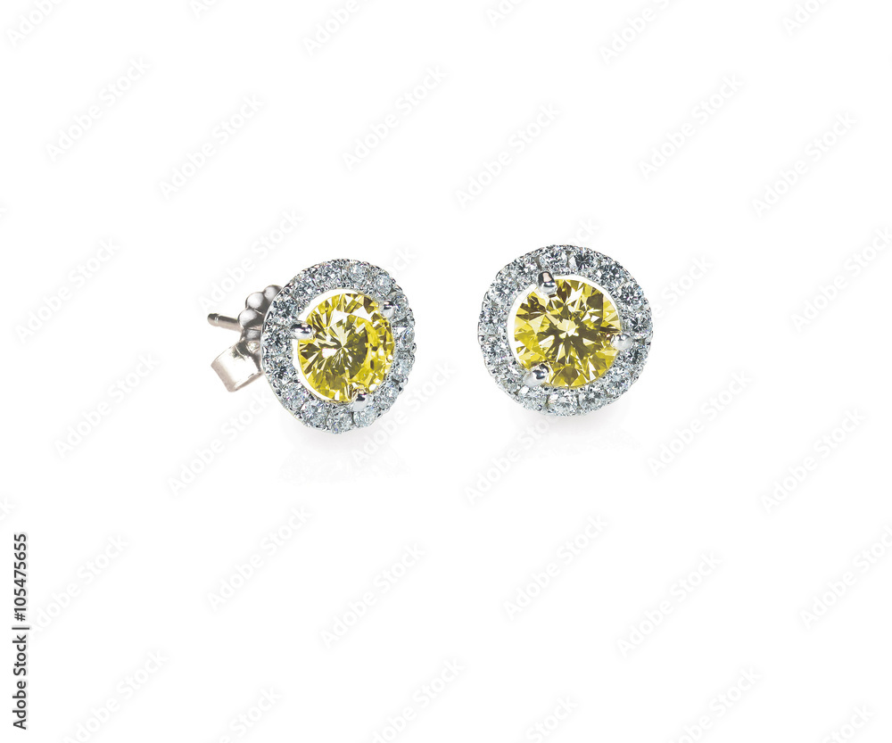 Yellow diamond citrine topaz stud earrings pair isolated on white Yellow diamond citrine topaz stud earrings pair isolated on white