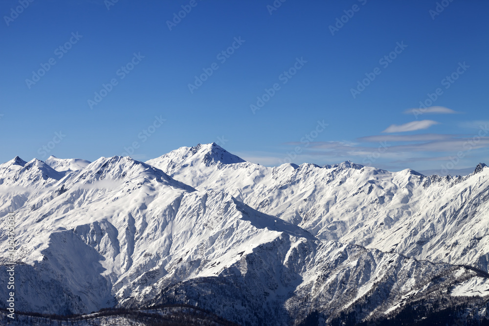 View on snowy mountains in sunny day