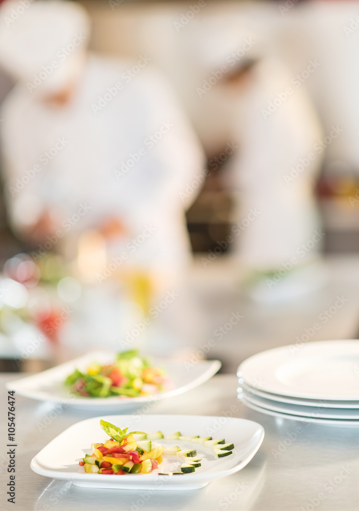 Close-up of stylish plates of colorful cut vegetables