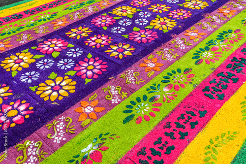 Closeup of floral pattern on handmade dyed sawdust Lent carpet for procession, Antigua, Guatemala