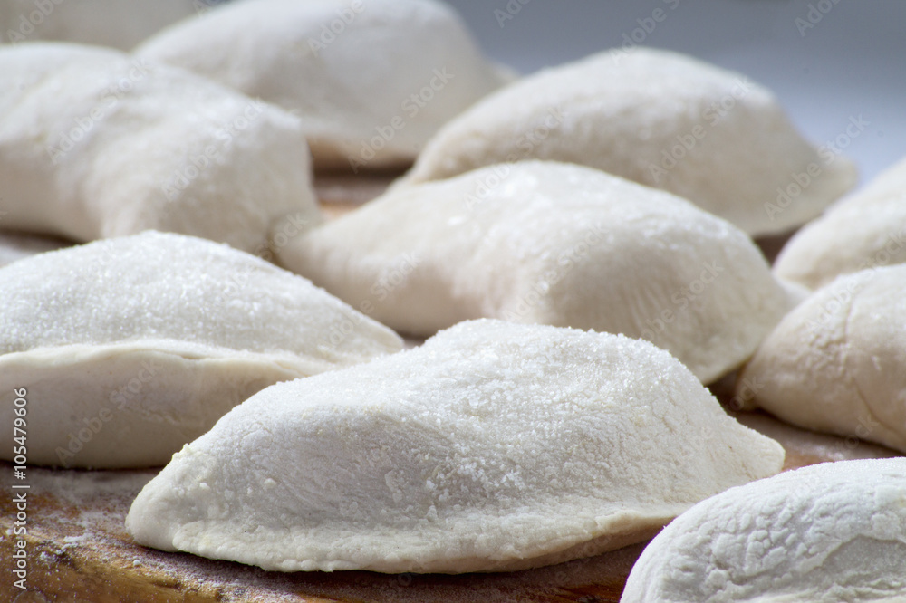 Dumplings are hired prepared for cooking in hot water Dumplings are hired prepared for cooking in hot water