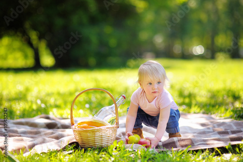 Toddler boy in sunny park