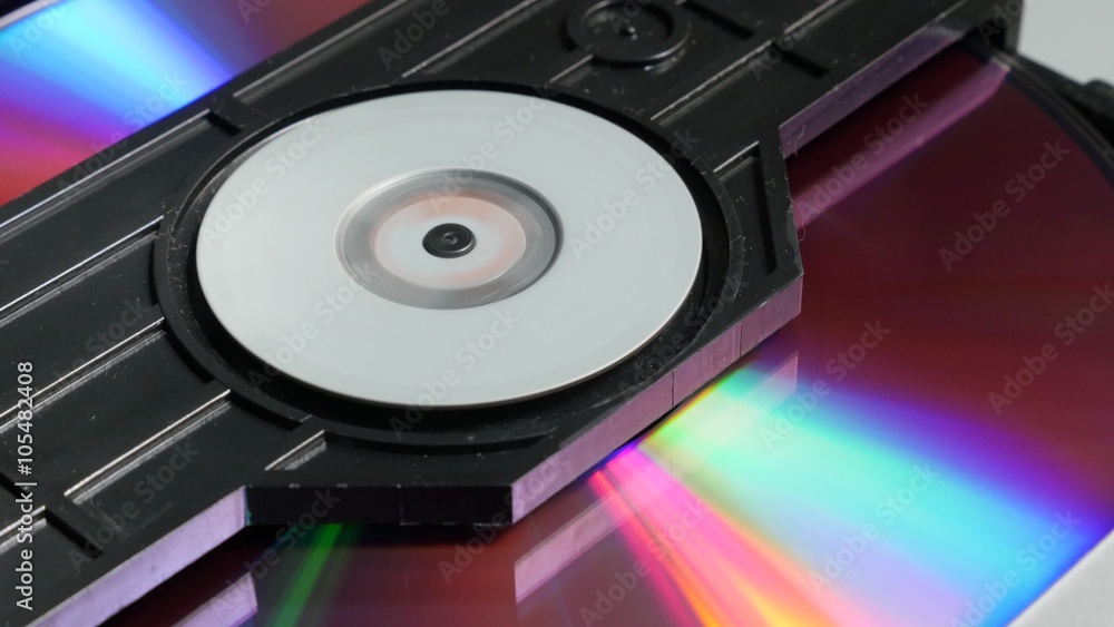Compact disc entering mechanism and starting reading sequence 4K 2160p UltraHD footage - DVD player mechanism close up 4K 3840X2160 UHD video Compact disc entering mechanism and starting reading sequence 4K 2160p UltraHD footage - DVD player mechanism close up 4K 3840X2160 UHD video