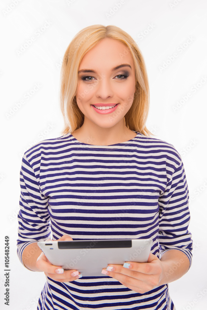 Attractive smiling young woman holding tablet on white backgroun Attractive smiling young woman holding tablet on white backgroun