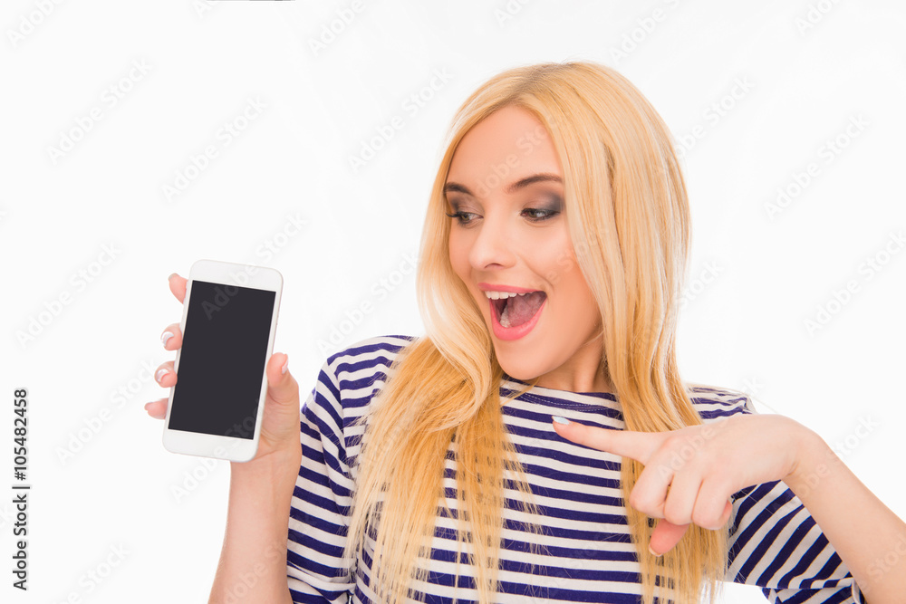 Pretty young girl pointing on black screen of mobile phone Pretty young girl pointing on black screen of mobile phone