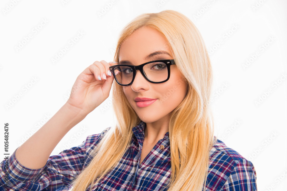 Beautiful smiling blonde touching glasses on white background