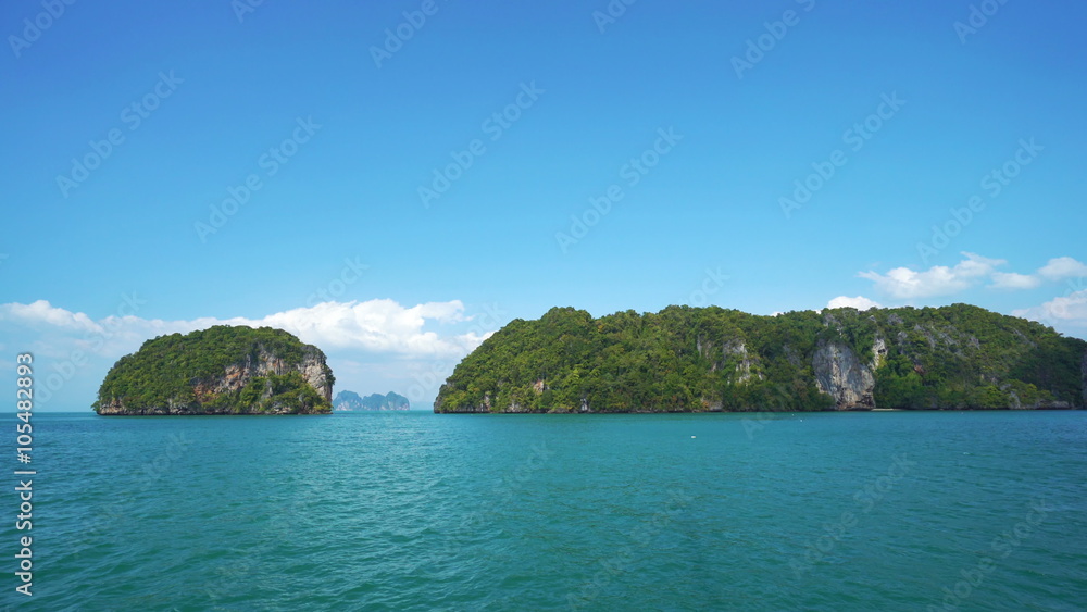 Yacht Runs Along Islands on the Andaman Sea. A Hot Summer Day. Yacht Runs Along Islands on the Andaman Sea. A Hot Summer Day.