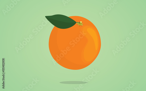 orange fruit with leaf on the top and green background