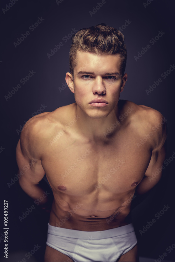 A man model in a white panties. A man model in a white panties.