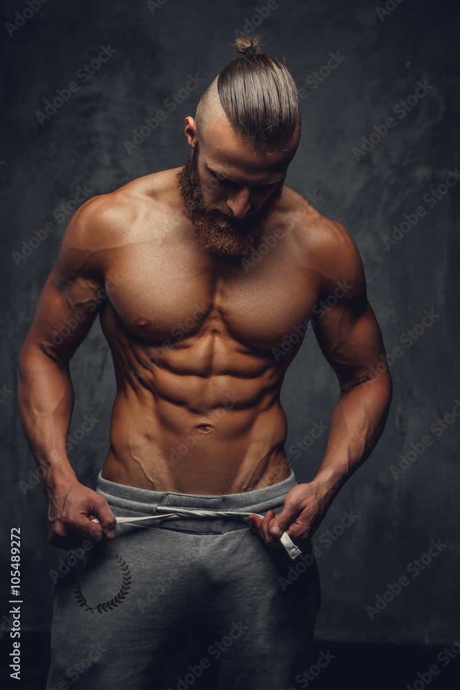Fototapeta premium Shirtless muscular man with beard.